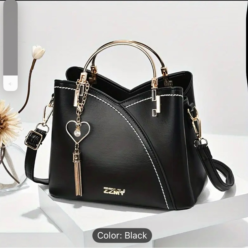 Elegant Black Handbag with Gold Accents